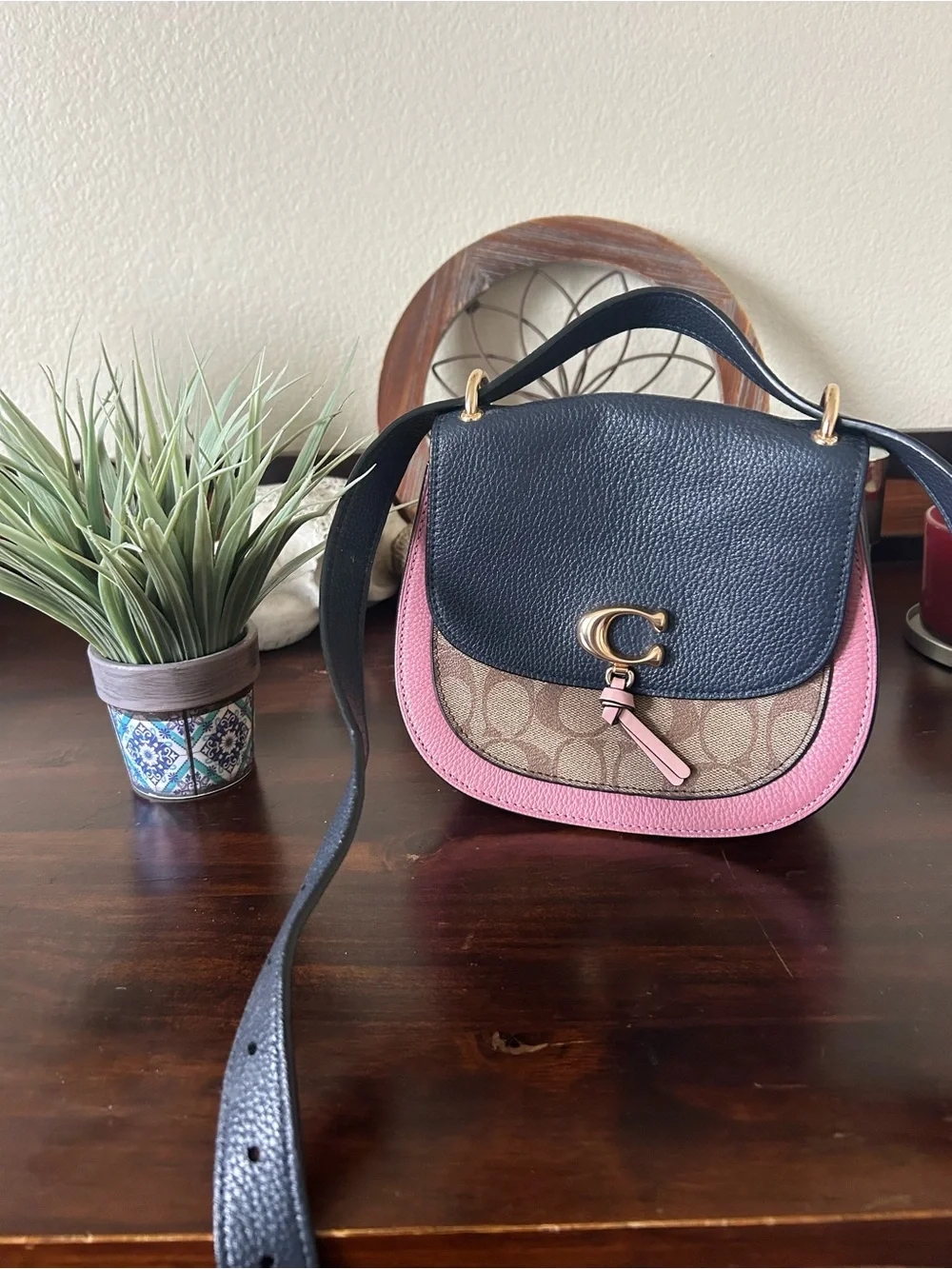 Coach Signature Remi Saddle Crossbody in navy blue and pink, classic coach